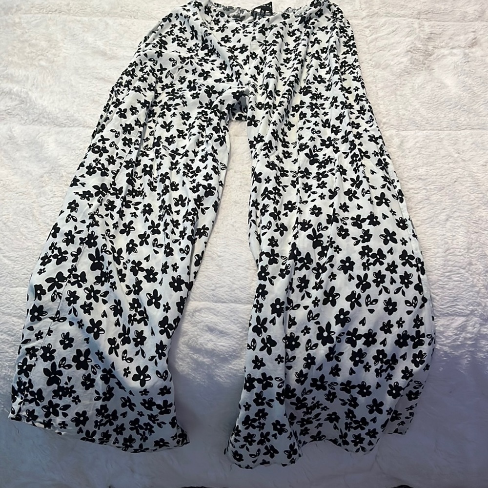 White flair pants with black flowers